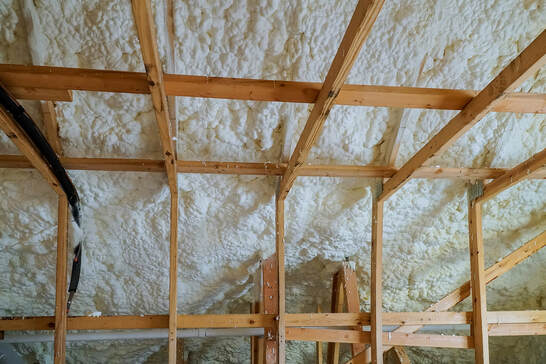 Insulation of attic with foam insulation done by greenwich insulation.